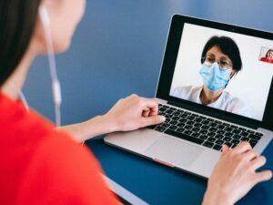pexels-photo-4225920-4225920 Doctor and patient on a video call for telehealth consultation during COVID-19 era.